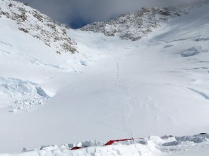A trail of climbers heading up the Headwall from 14k Camp on Denali